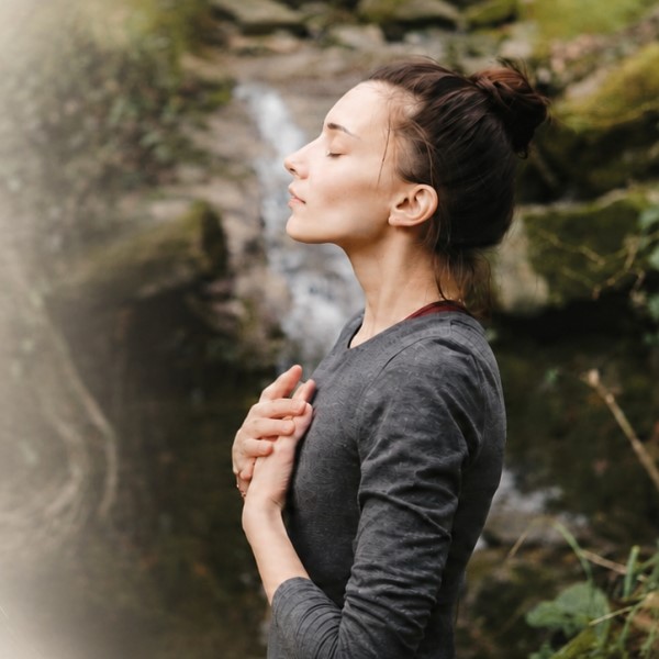 Woman receiving Reiki healing treatment in a peaceful wellness studio in Hamilton East NSW