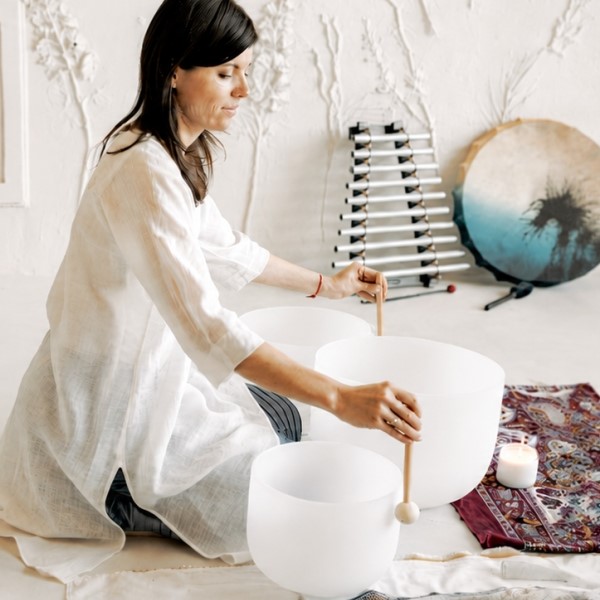 Woman receiving Reiki healing treatment in a peaceful wellness studio in Hamilton East NSW